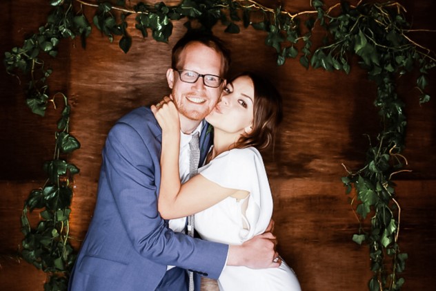 Bride and groom in wedding photo booth