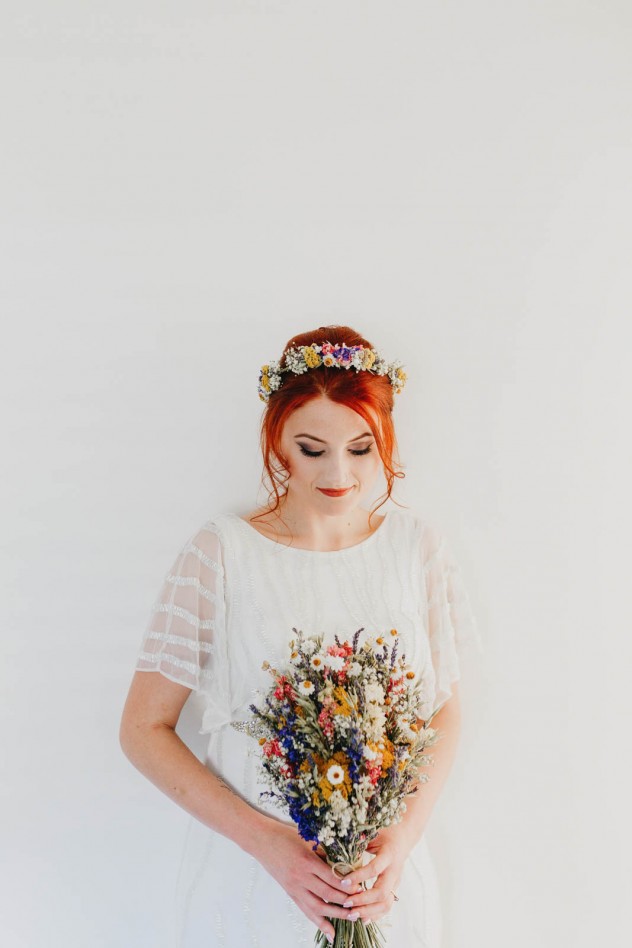 Indie bride with dried wedding bouquet