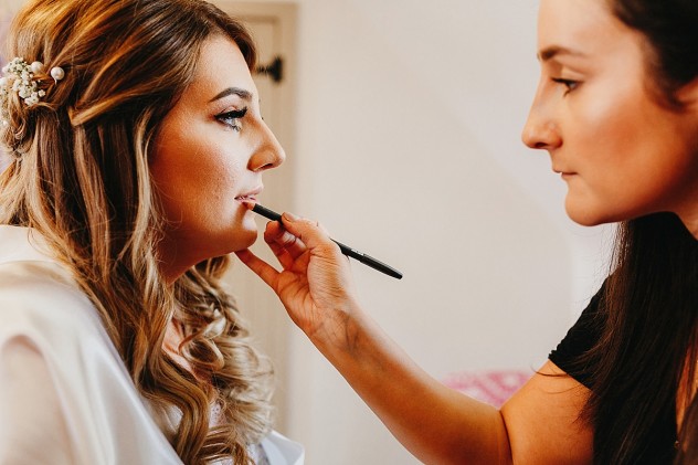 Bridal lipstick being applied