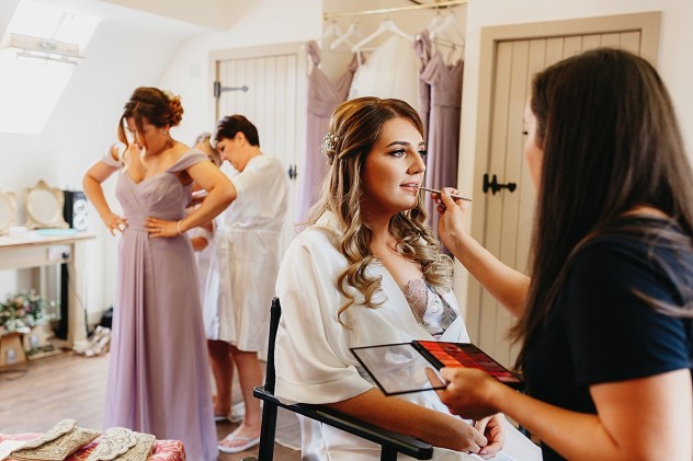 Bridal makeup being applied