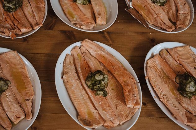 Six plates of salmon lined up for Wilde Lodge wedding reception