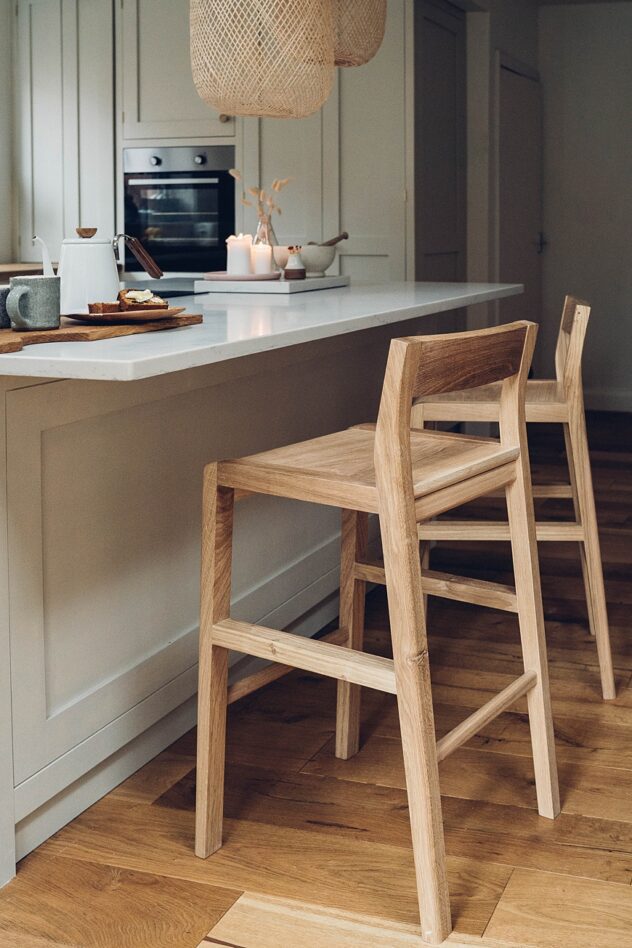 Two oak bar stools at kitchen island handmade in Shropshire. Brand storytelling