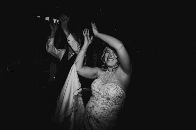 Bride and Groom clapping and dancing at Iscoyd Park Wedding reception