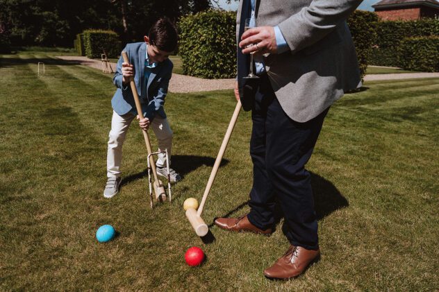 Guests playing croquet on the lawn at Iscoyd Park