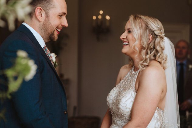 Bride and Groom share vows during ceremony in the Drawing Room at Iscoyd Park