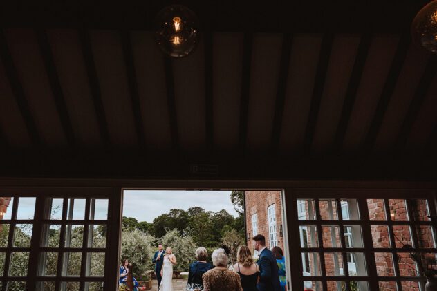 View through the window of the Coach House at Iscoyd Park Wedding reception