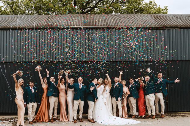 Bridal party under confetti canon at Stanford Farm