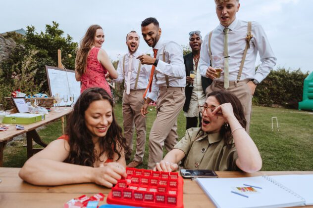 Guests playing games on lawn, shropshire wedding reception