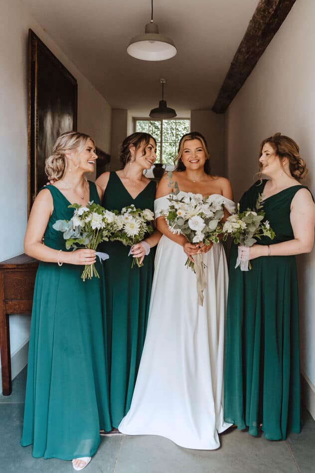 Bride in Stella York wedding dress and bridesmaids in forest green wed 2 be dresses at Pimhill barn wedding