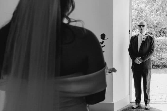 Father of the bride sees daughter in dress for the first time at Pimhill barn wedding