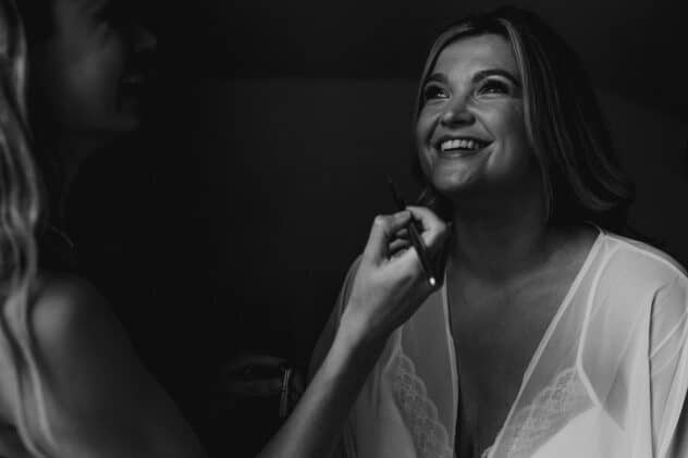 Jess Jackson make up artist applying brides make up at Pimhill barn wedding