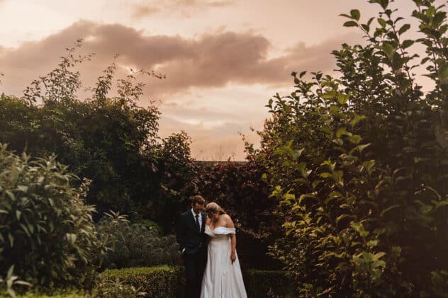 Golden hour photos of Bride and groom strolling through the grounds of Pimhill barn at Pimhill barn wedding