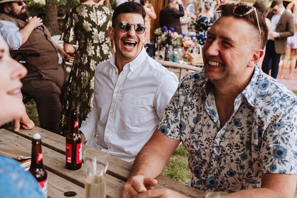 Candid Shropshire wedding photography of wedding guests laughing