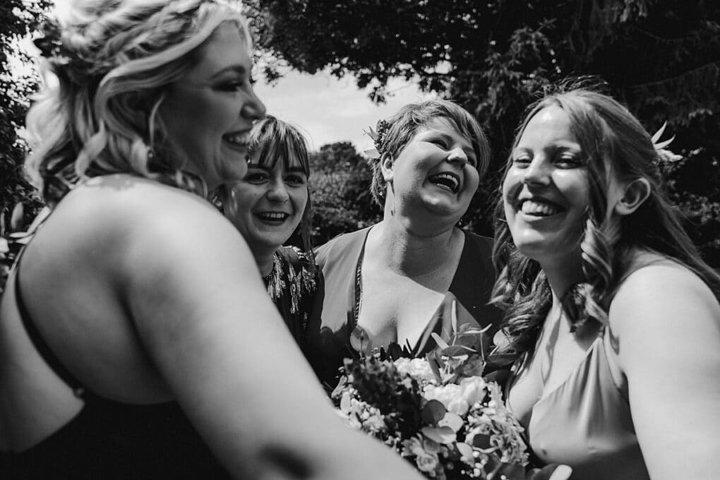 Candid Shropshire wedding photography of bridemaids laughing