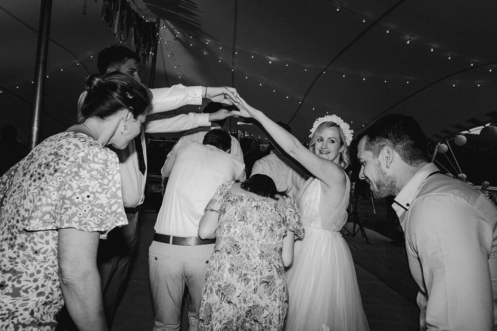 Shropshire wedding photography of the wedding guests doing ceilidh