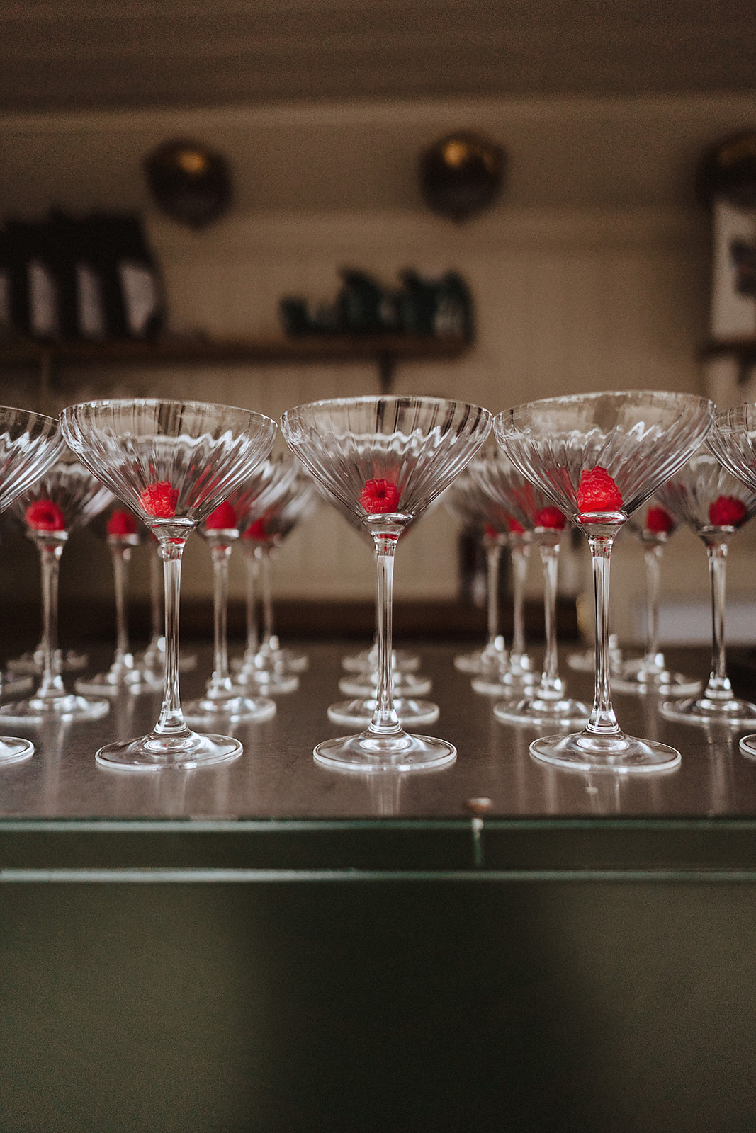 French Martini glasses with raspberrys in lined up at No.131 The Promenade Cheltneham