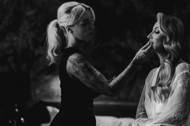 Candid photo of bride having make up applied at No.131 The Promenade Cheltenham