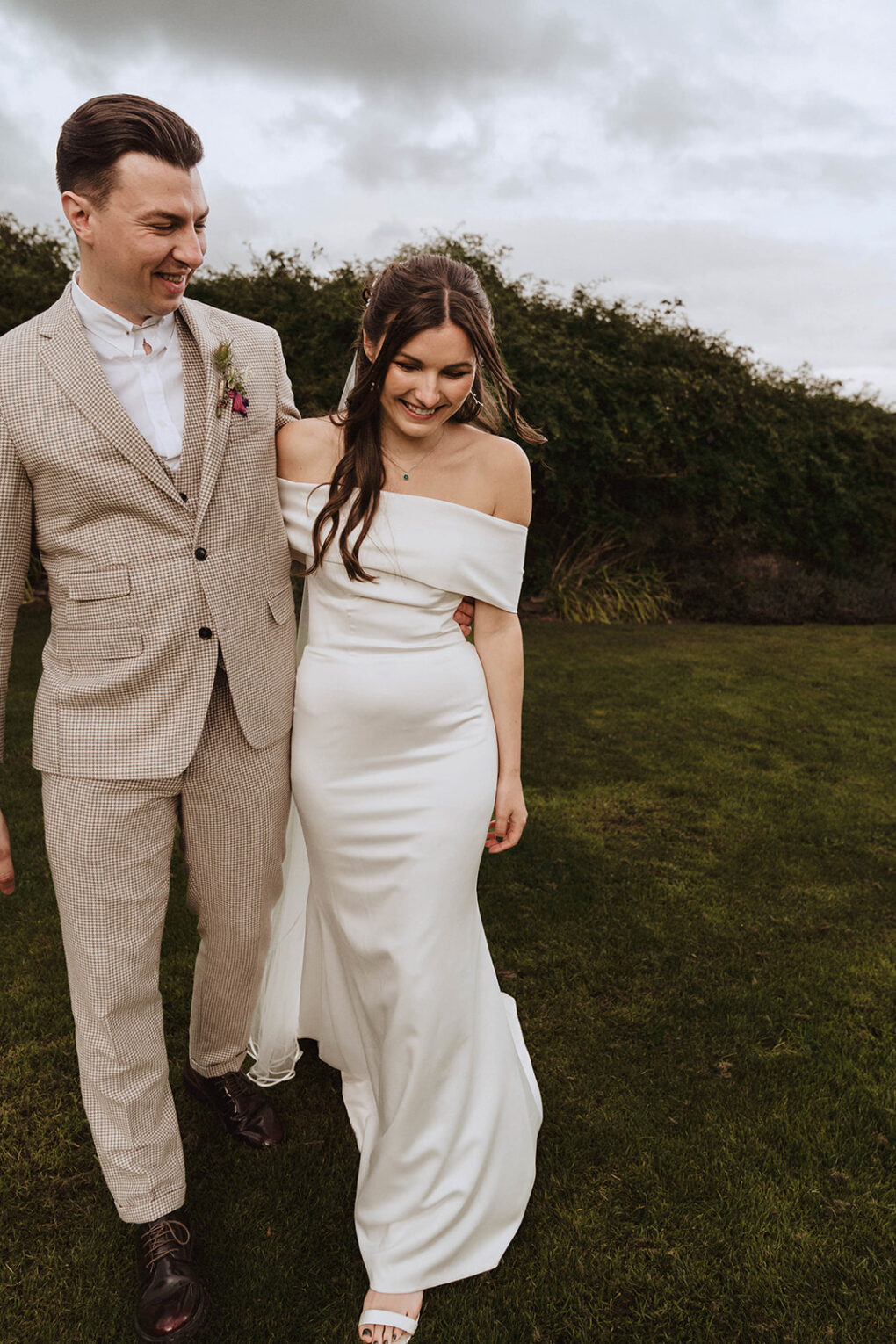 Quiet, unscripted moment between a bride and groom during their intimate wedding at Wilde Lodge, captured in a natural, documentary photography style.