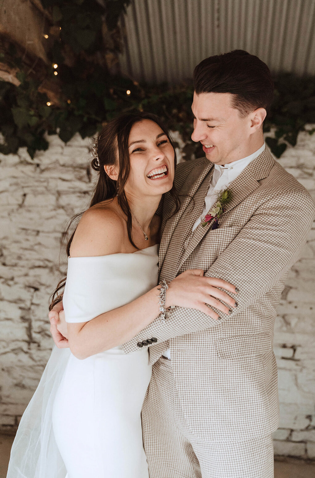 Quiet, unscripted moment between a bride and groom during their intimate wedding at Wilde Lodge, captured in a natural, documentary photography style.