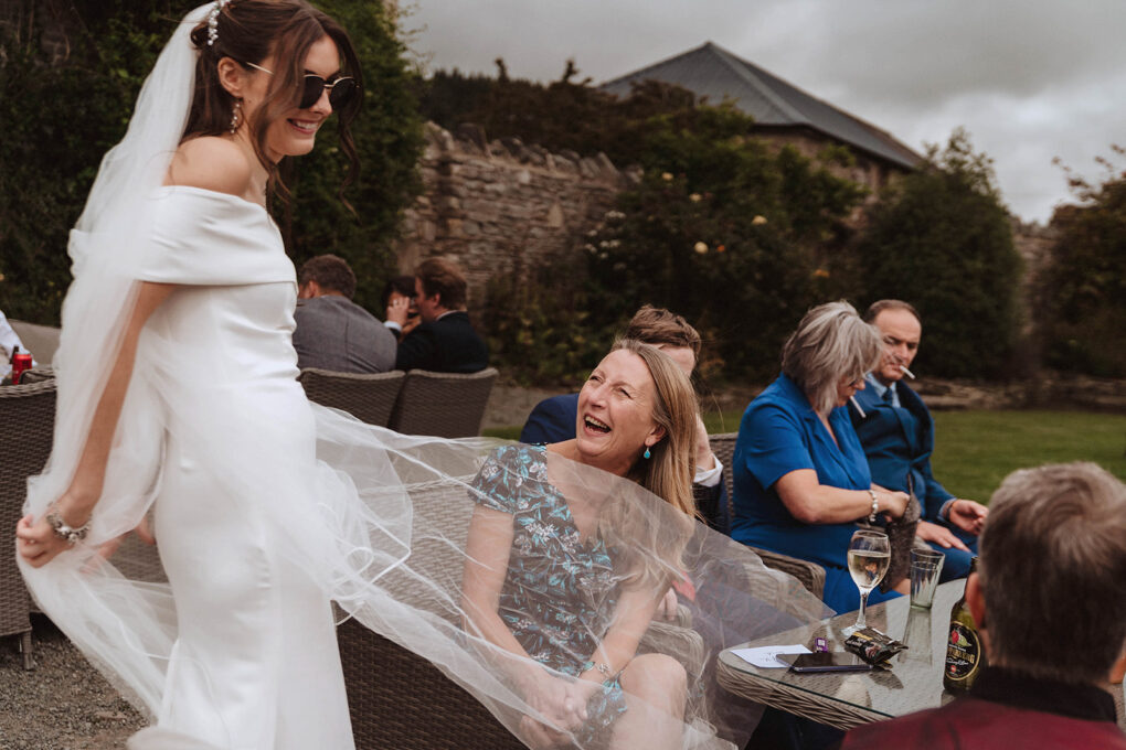 Candid laughter and honest connections between guests during a relaxed, intimate wedding at Wilde Lodge
