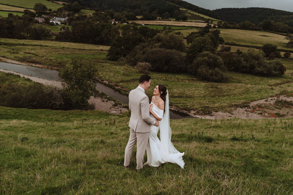 Quiet, unscripted moment between a bride and groom during their intimate wedding at Wilde Lodge, captured in a natural, documentary photography style.