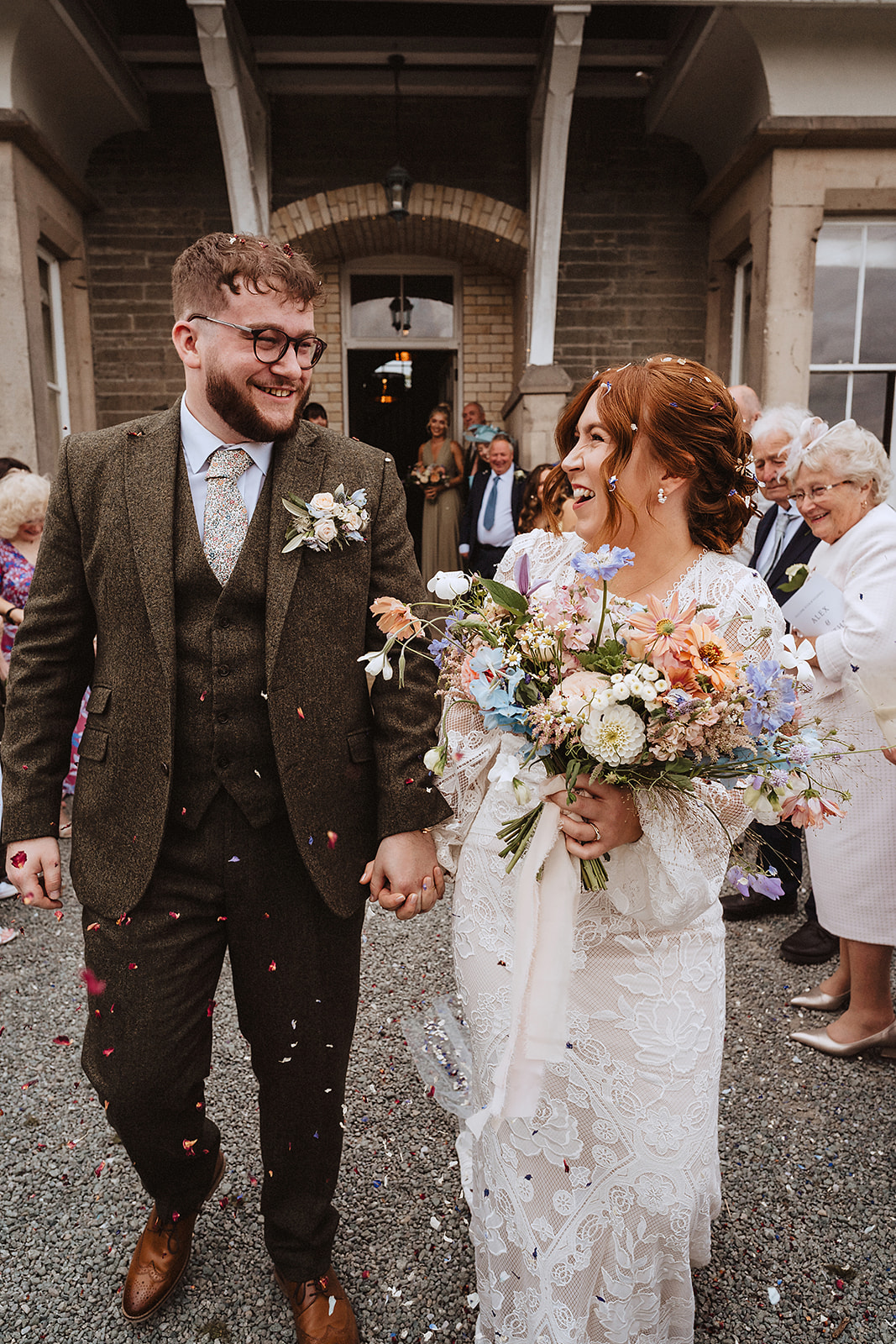A relaxed wedding photographer in Shropshire captures a candid confetti moment