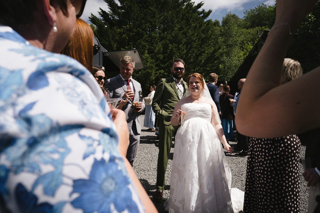 Real wedding reception moments inside the rustic barn setup at Glyngynwydd Wedding Barn.