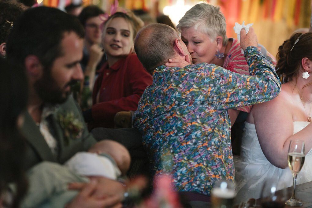 Candid photo of wedding guests at Glyngynwydd Wedding Barn