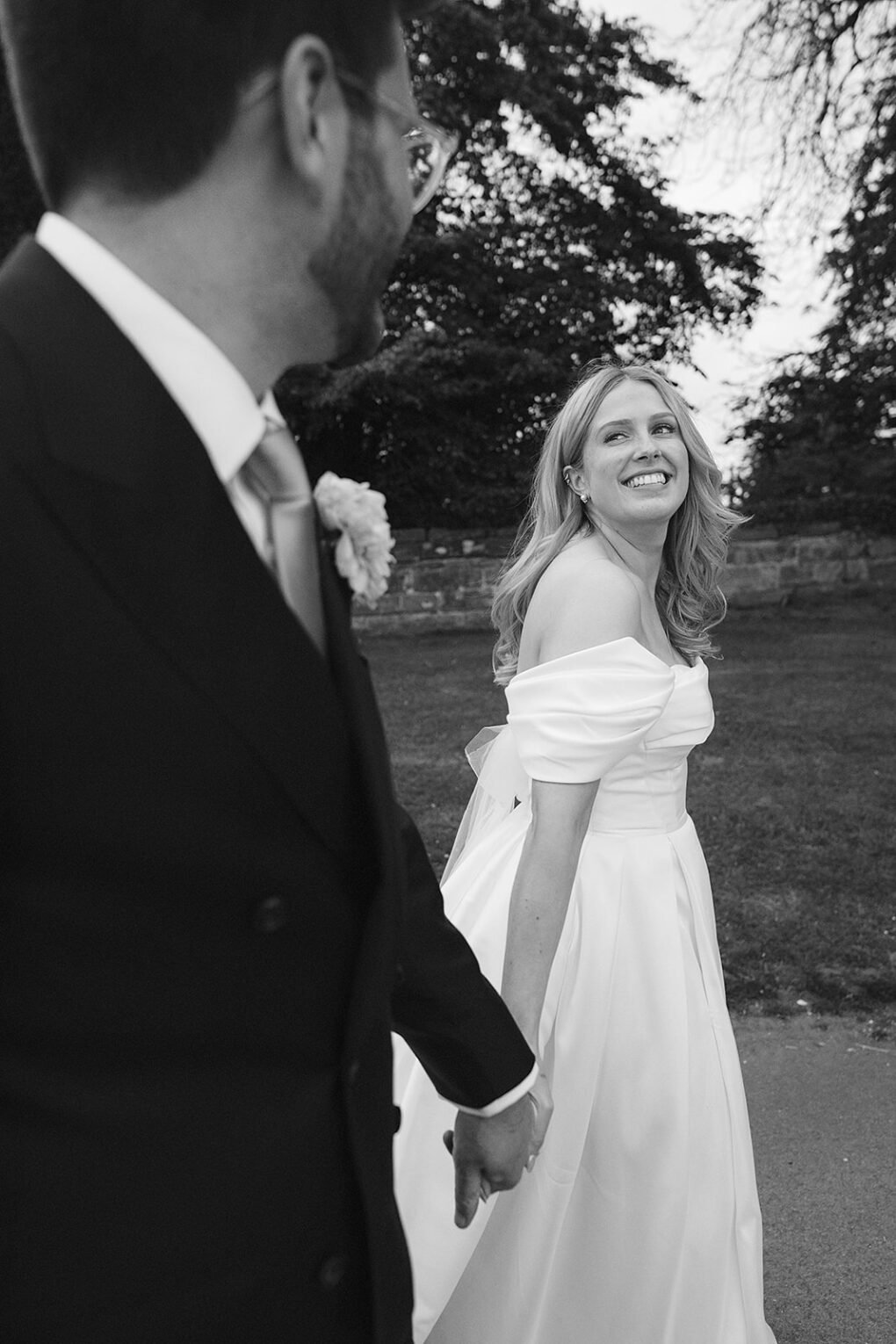 Candid photo of a bride and groom walking showcasing the unposed, documentary wedding photography style of Indie Love.
